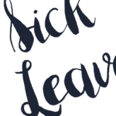 Hand holding a sign up that says 'sick leave'