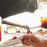 A group of people having a meeting around a table