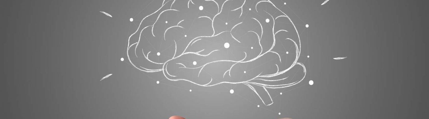 A drawn image of a brain with hand underneath