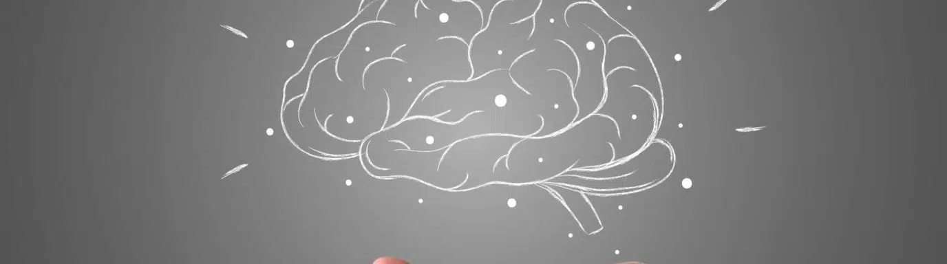 A drawn image of a brain with hand underneath